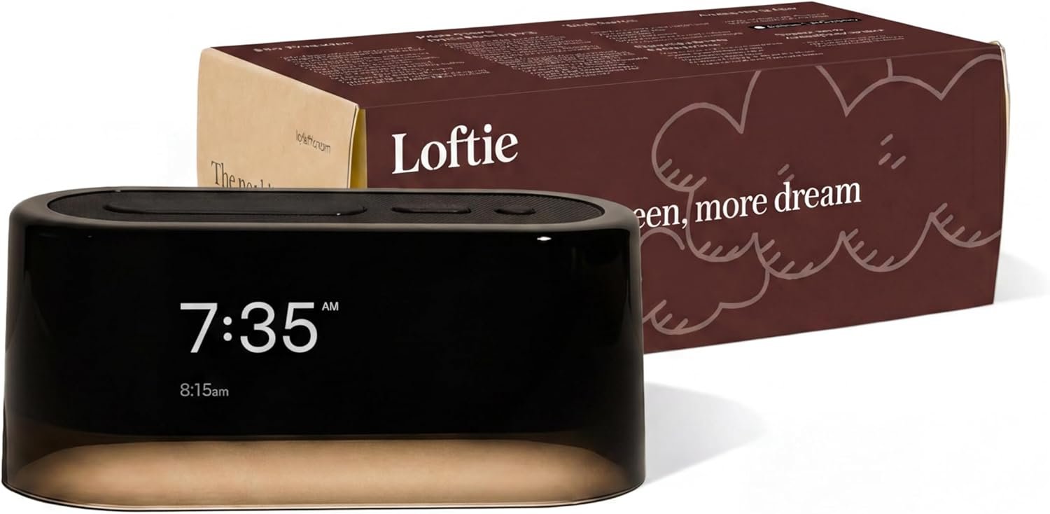 Black Loftie smart alarm clock on bedside table with night light and sound machine features