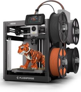 Multi-color 3D printer sitting on a home office desk printing a small organizer